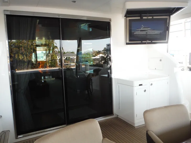 Slide: The Image of Luxurious 2015 Horizon E88 yacht interior with elegant wood paneling and modern furnishings. - 15