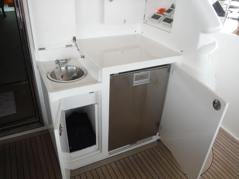 Slide: The Image of Luxurious bedroom interior of 2015 Horizon E88 yacht with elegant wood finishes and modern design. - 18