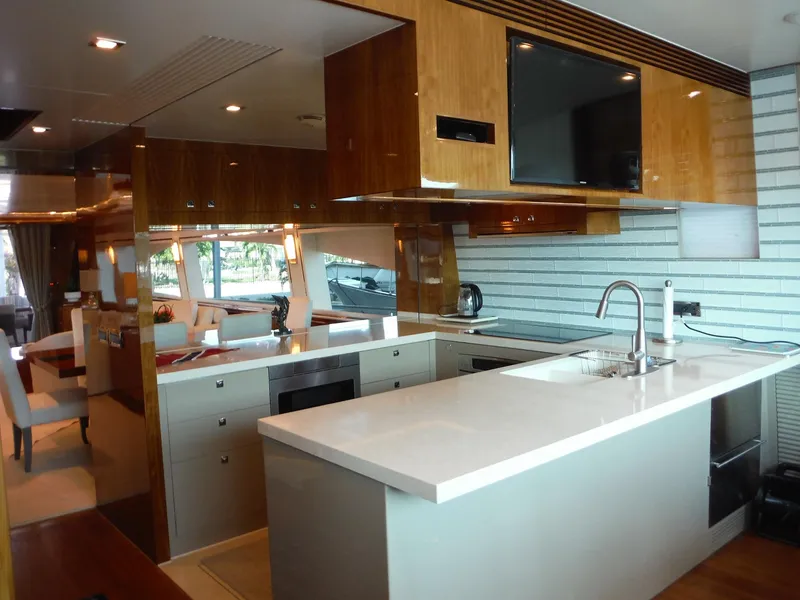 Slide: The Image of Luxury yacht "Encore" docked, Horizon E88 model, 2015, with ocean view and wooden deck. - 26