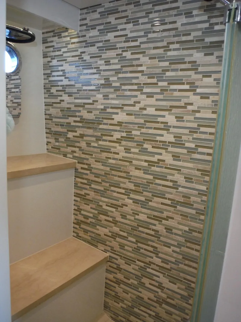 Slide: The Image of Luxurious wooden staircase with LED lighting on a 2015 Horizon E88 yacht. - 42