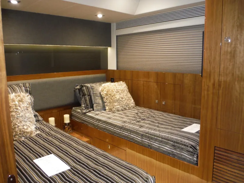 Slide: The Image of Luxury Horizon E88 yacht deck with ocean view, featuring elegant seating and table, 2015 model. - 55