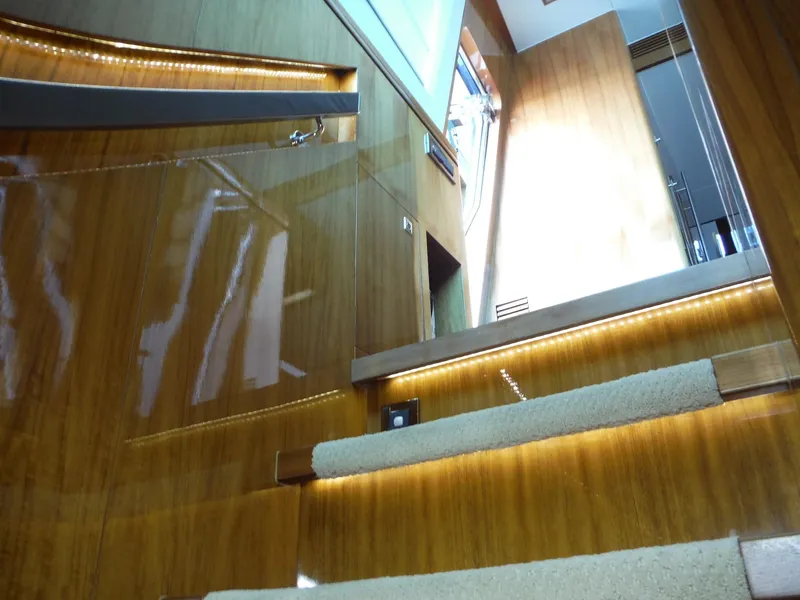 Slide: The Image of Luxurious Horizon E88 yacht interior with spiral staircase, ocean view, and modern design, 2015 model. - 58