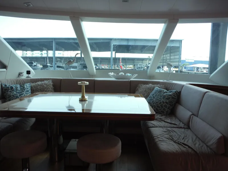 Slide: The Image of Luxury Horizon E88 yacht deck with dining area, ocean view, and sleek design, 2015 model. - 59