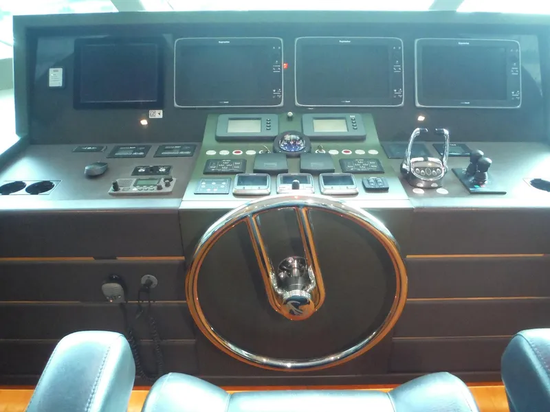 Slide: The Image of Luxurious Horizon E88 yacht deck with comfortable seating, ocean view, and American flag, 2015 model. - 64