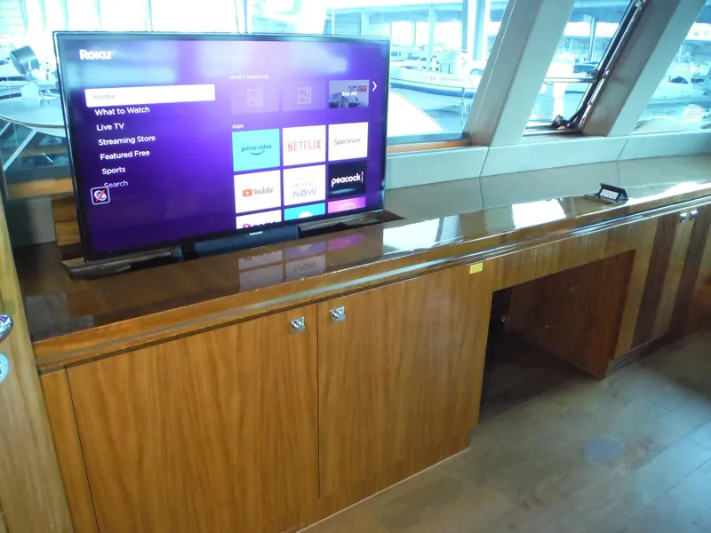 Slide: The Image of Luxury Horizon E88 yacht interior with open hatch, wooden deck, and ocean view, 2015 model. - 66