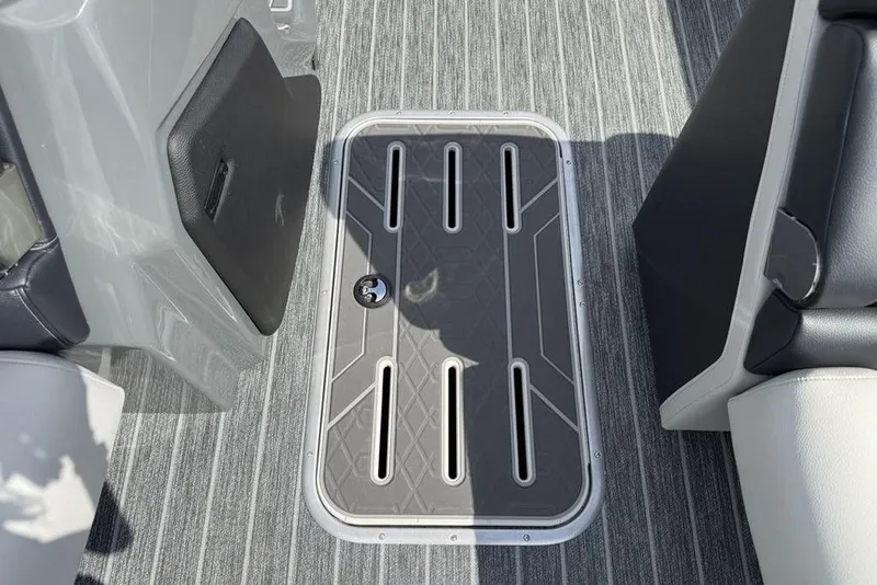 Slide: The Image of 2026 Premier 230 Intrigue RF boat interior with sleek flooring and storage compartment. - 14