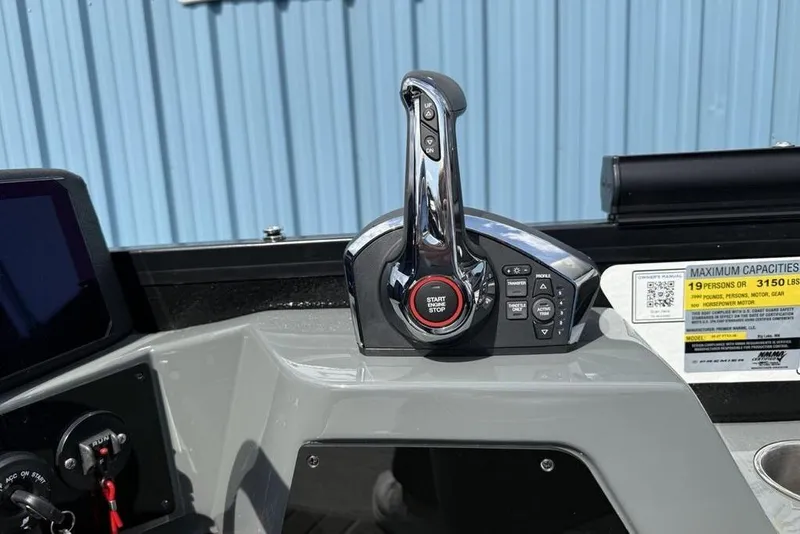Slide: The Image of Control panel of 2026 Premier 230 Intrigue RF boat with start-stop button and capacity label. - 22