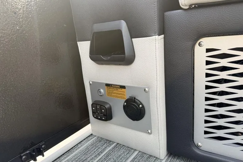 Slide: The Image of Control panel and speaker on 2026 Premier 230 Intrigue RF boat interior. - 31
