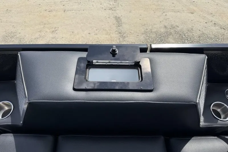 Slide: The Image of 2026 Premier 230 Intrigue RF dashboard with sleek black leather and integrated cup holders. - 32