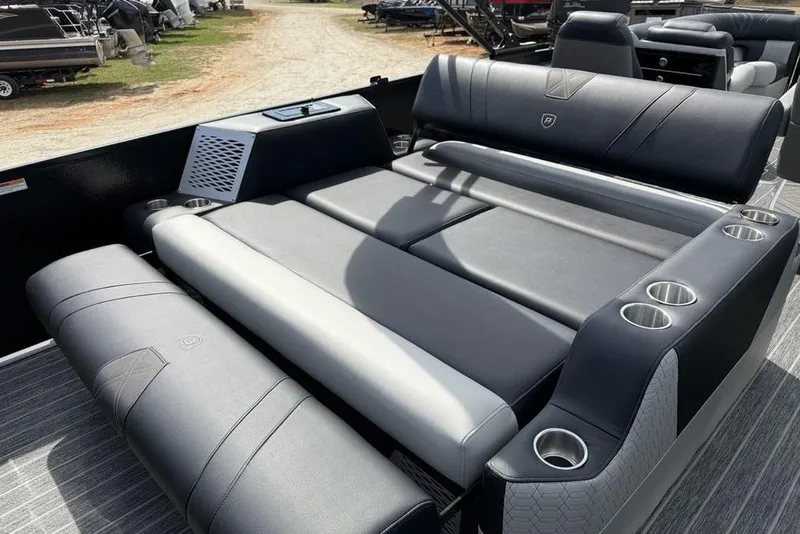 Slide: The Image of 2026 Premier 230 Intrigue RF boat interior with luxurious seating and cup holders. - 33