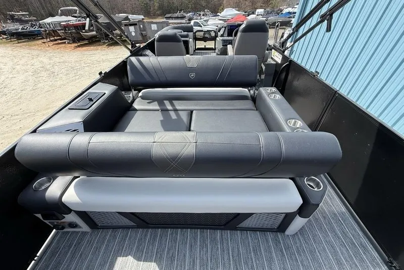 Slide: The Image of 2026 Premier 230 Intrigue RF boat interior with luxurious seating and cup holders. - 37