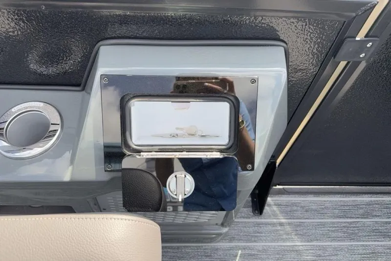 Slide: The Image of Control panel of 2026 Premier 230 Intrigue RF boat with key ignition. - 40