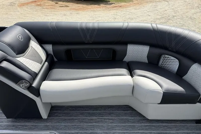 Slide: The Image of Luxurious seating on 2026 Premier 230 Intrigue RF boat, featuring sleek black and white upholstery. - 8