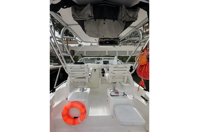 Slide: The Image of 2005 Century 2600 Walk-Around boat interior with seating and safety equipment. - 11