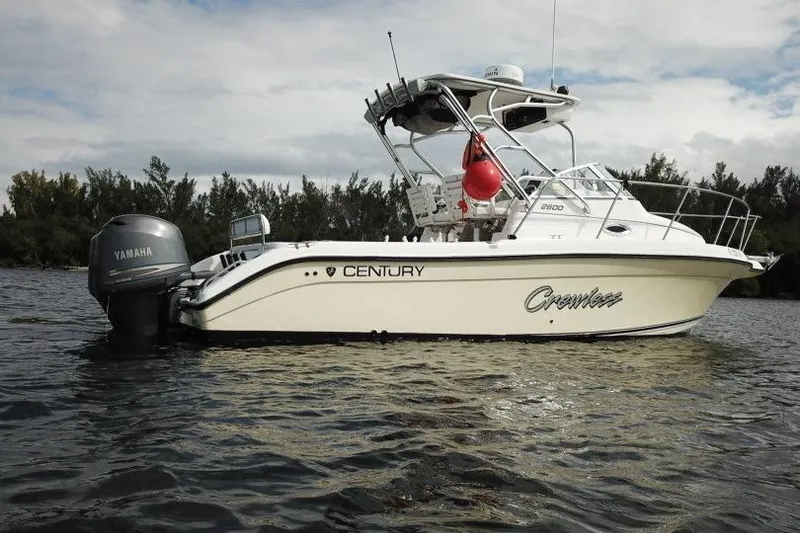 Slide: The Image of 2005 Century 2600 Walk-Around boat with Yamaha engine on calm water. - 17
