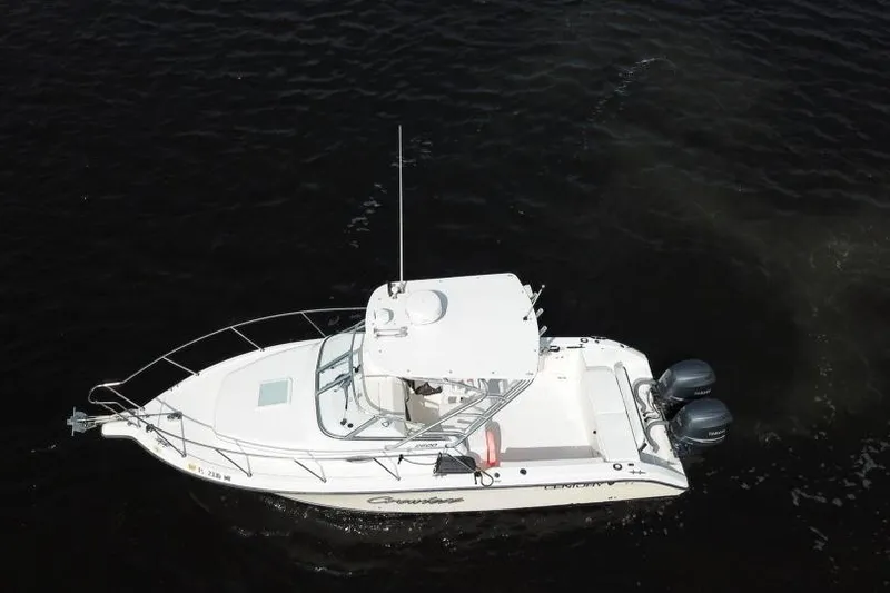 Slide: The Image of 2005 Century 2600 Walk-Around boat on dark water, aerial view. - 4