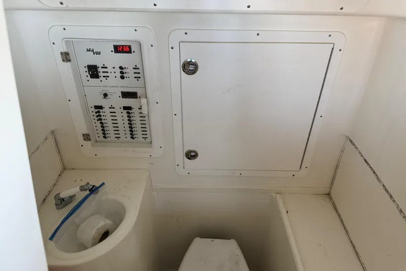 Slide: The Image of 2016 SeaVee 370Z boat interior with control panel and storage compartment. - 17