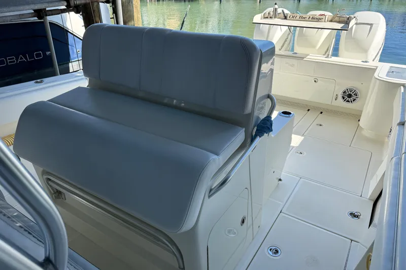 Slide: The Image of 2016 SeaVee 370Z boat interior with seating and deck view. - 19