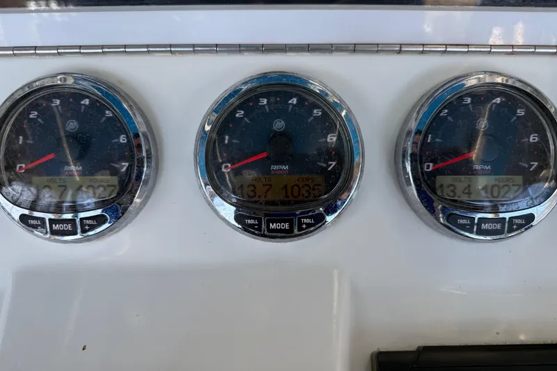 Slide: The Image of 2016 SeaVee 370Z dashboard with three RPM gauges displaying engine data. - 3