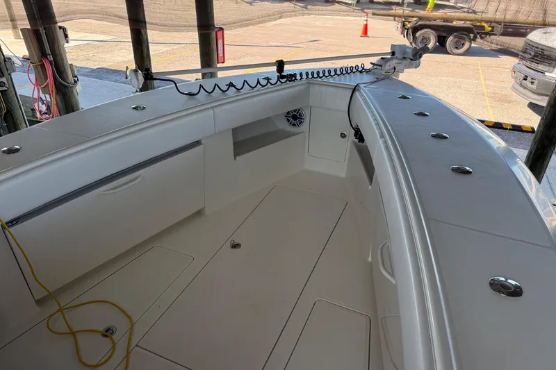 Slide: The Image of 2016 SeaVee 370Z boat interior with storage compartments and fishing rod holders. - 5