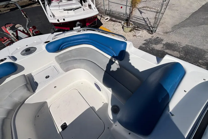Slide: The Image of 2006 Hurricane SunDeck 217 OB boat interior with blue and gray seating. - 16