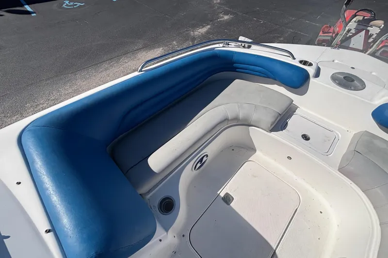 Slide: The Image of 2006 Hurricane SunDeck 217 OB boat interior with blue and gray seating. - 17