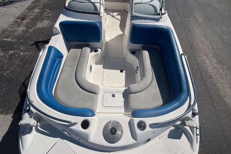 Slide: The Image of 2006 Hurricane SunDeck 217 OB boat with blue and gray seating, top view. - 20