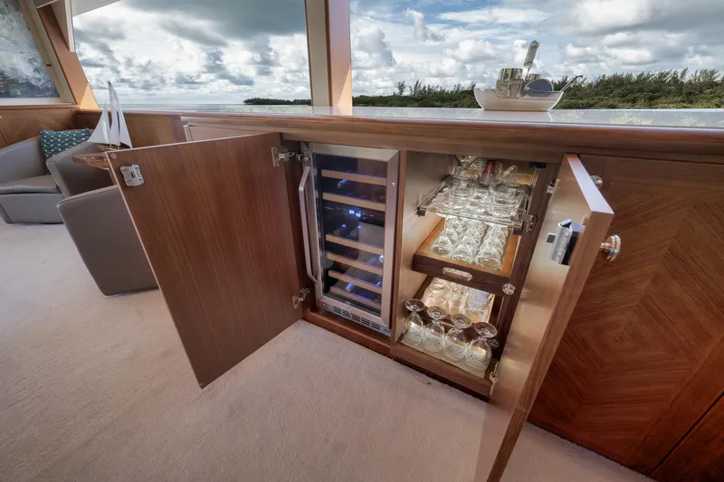 Slide: The Image of Luxurious interior of 2017 Ocean Alexander 85 E yacht with wine storage and glassware. - 12
