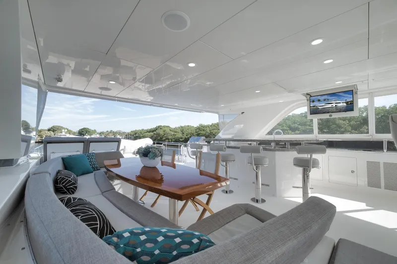 Slide: The Image of Luxurious 2017 Ocean Alexander 85 E yacht interior with elegant seating and bar area. - 17