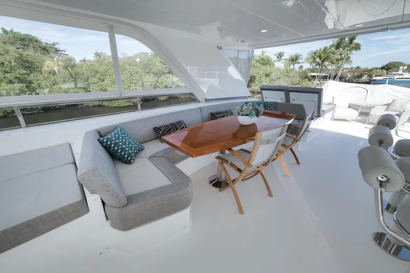 Slide: The Image of Luxurious 2017 Ocean Alexander 85 E yacht deck with elegant seating and dining area. - 18