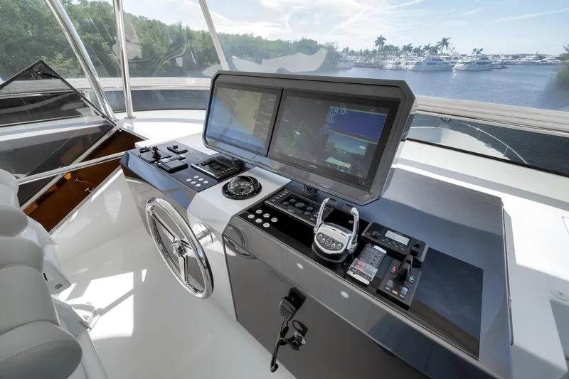 Slide: The Image of Helm station of 2017 Ocean Alexander 85 E yacht with advanced navigation controls. - 23