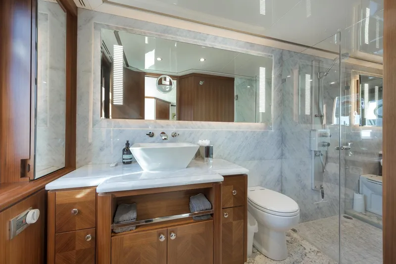 Slide: The Image of Luxurious bathroom in 2017 Ocean Alexander 85 E yacht with marble and wood finishes. - 27