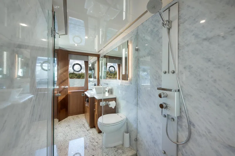Slide: The Image of Luxurious bathroom on 2017 Ocean Alexander 85 E yacht with marble walls and modern fixtures. - 28