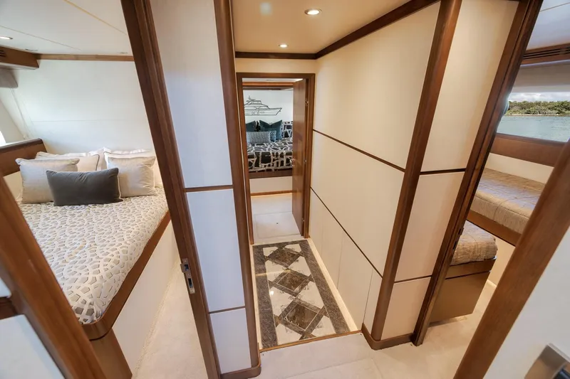 Slide: The Image of Luxurious interior of 2017 Ocean Alexander 85 E yacht, featuring elegant bedrooms and hallway. - 33