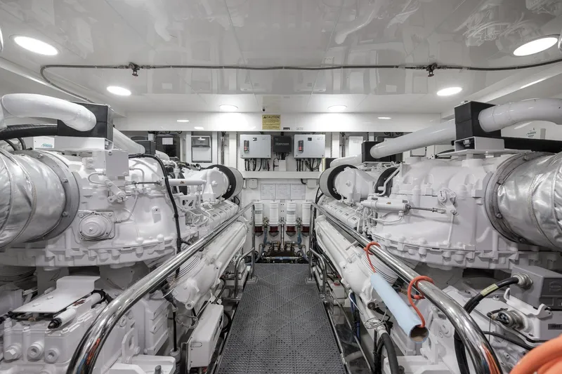 Slide: The Image of Engine room of 2017 Ocean Alexander 85 E yacht, featuring dual engines and modern equipment. - 36