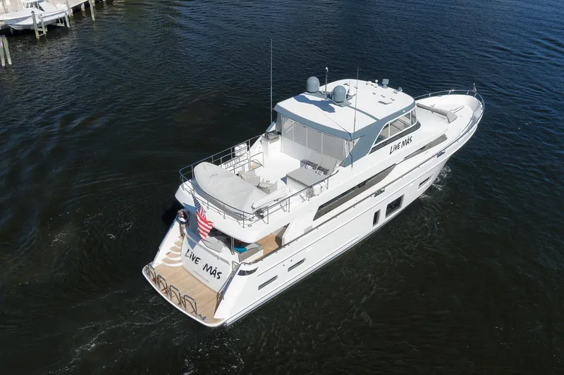Slide: The Image of 2017 Ocean Alexander 85 E yacht cruising on open water, aerial view. - 38
