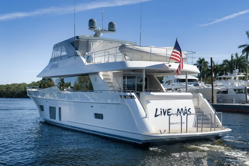 Slide: The Image of Luxury 2017 Ocean Alexander 85 E yacht on water, featuring "Live Más" branding. - 4
