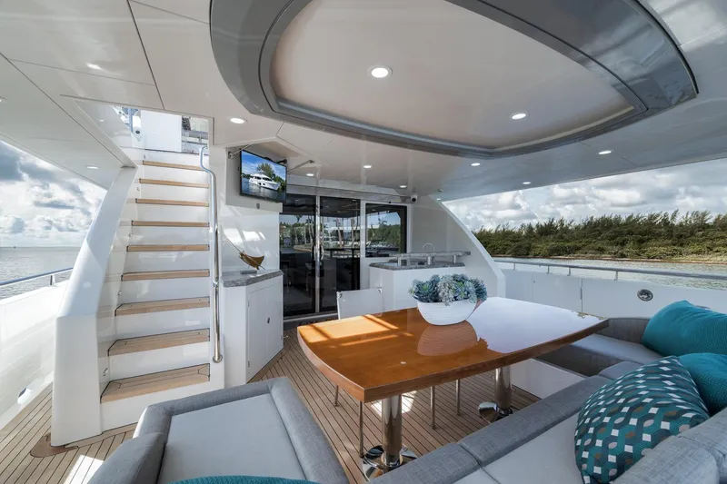 Slide: The Image of Luxurious 2017 Ocean Alexander 85 E yacht deck with elegant seating and scenic views. - 6