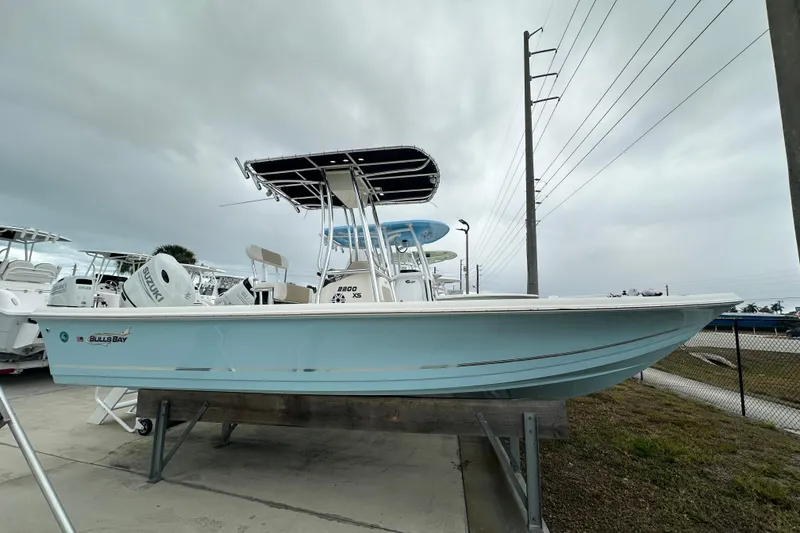 The Image of 2026 Bulls Bay 2200 XS boat displayed outdoors on a stand. - 1