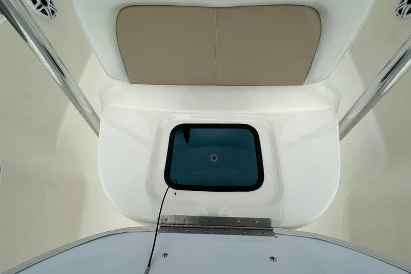 Slide: The Image of 2026 Bulls Bay 2200 XS boat interior with cushioned seating and storage compartment. - 11