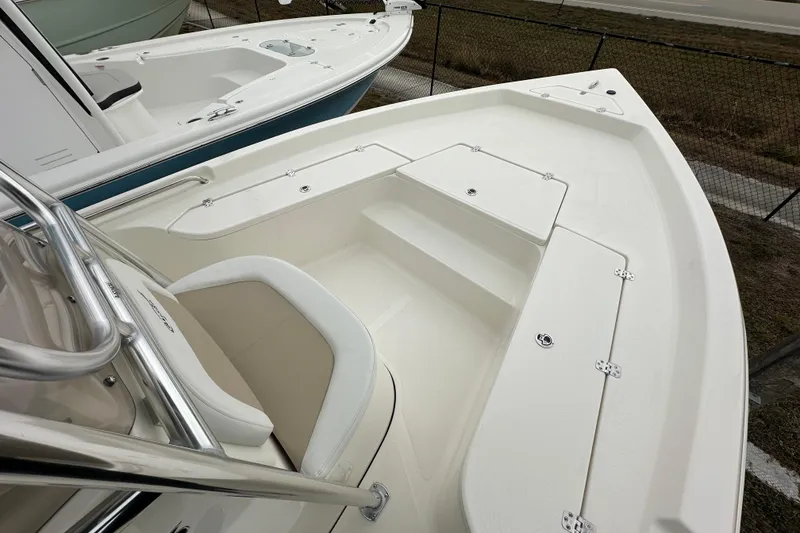 Slide: The Image of 2026 Bulls Bay 2200 XS boat, white interior, spacious seating, and storage compartments. - 6