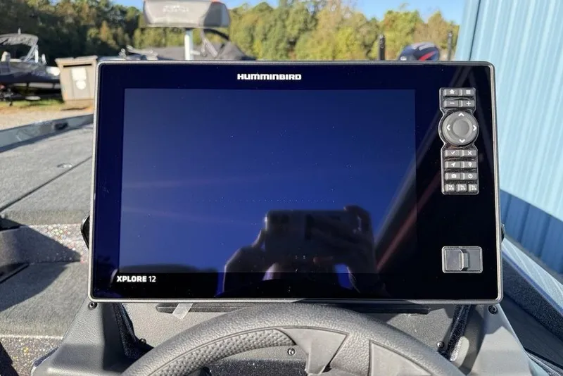 Slide: The Image of 2026 Skeeter ZXE20 boat with Humminbird Xplore 12 display, outdoor setting. - 18