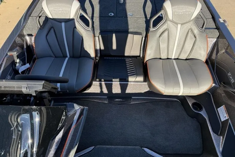 Slide: The Image of 2026 Skeeter ZXE20 boat interior with dual gray seats and sleek design. - 19