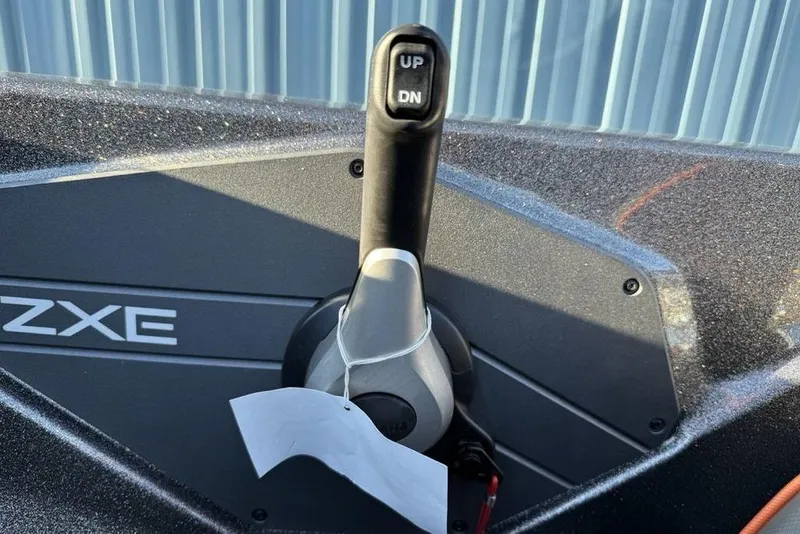 Slide: The Image of Control lever of 2026 Skeeter ZXE20 boat with "UP" and "DN" buttons. - 21