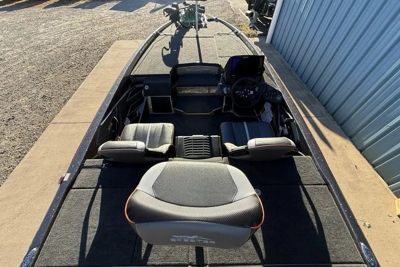 Slide: The Image of 2026 Skeeter ZXE20 fishing boat interior with seating and control panel. - 22