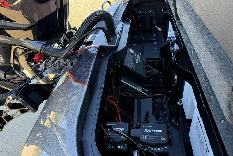 Slide: The Image of 2026 Skeeter ZXE20 boat engine compartment with batteries and wiring. - 25