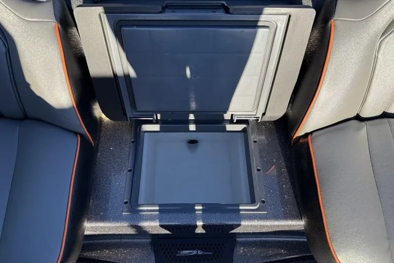 Slide: The Image of 2026 Skeeter ZXE20 boat storage compartment with sleek black and orange seating. - 28