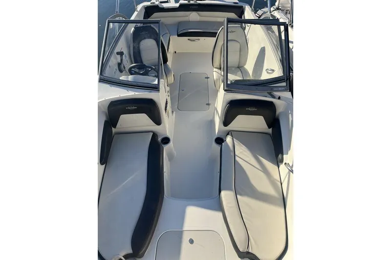 Slide: The Image of 2016 Stingray 191 DC boat interior with seating and open windshield. - 2