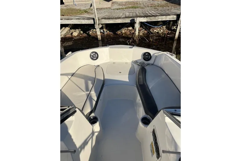 Slide: The Image of 2016 Stingray 191 DC boat interior with seating and speakers. - 3