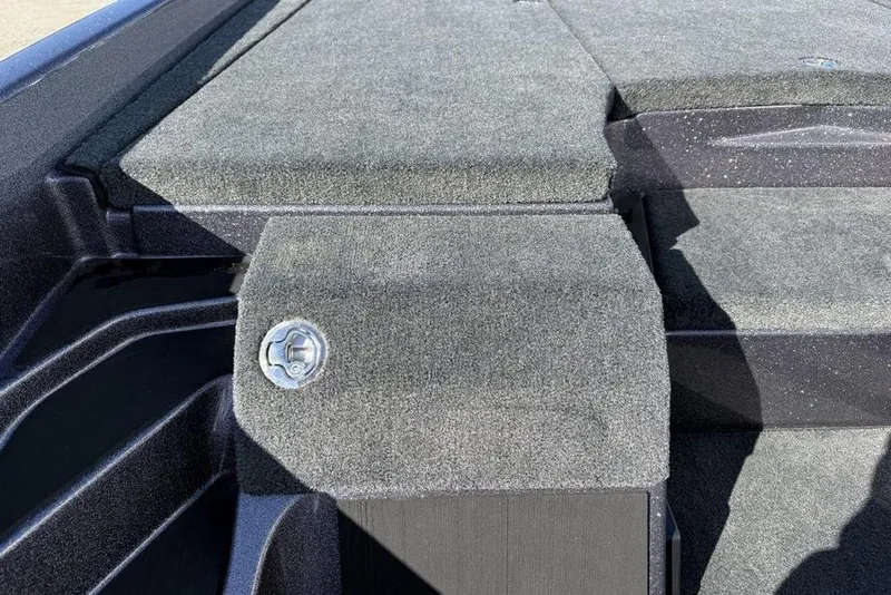 Slide: The Image of Carpeted deck of 2026 Skeeter ZXE21 boat with latch detail. - 11
